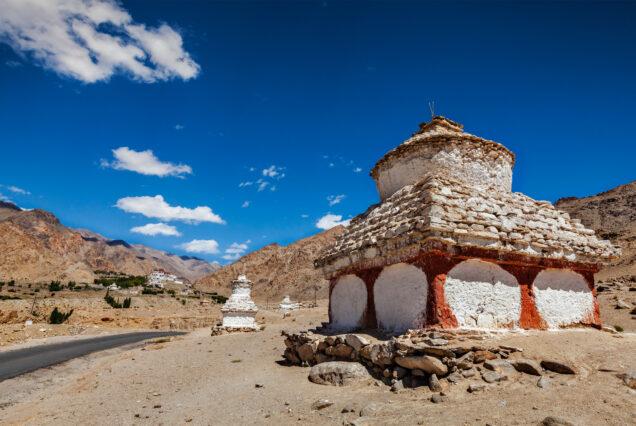Whitewashed chortens Buddhist stupas near Likir monastery. Ladakh, India